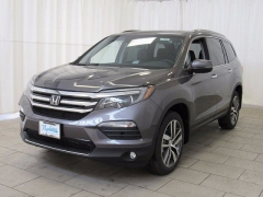 New 2018  Honda Pilot 4d SUV AWD Touring at Promax Motors near Davenport, IA