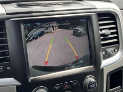 Used 2016  Ram 1500 4WD Quad Cab SLT at Paradise Motors near Lansing, MI