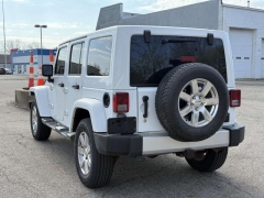 Used 2015  Jeep Wrangler Unlimited 4d Convertible Sahara at Paradise Motors near Lansing&comma; MI