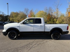 Used 2014  Ram 1500 4WD Quad Cab SLT at Paradise Motors near Lansing, MI
