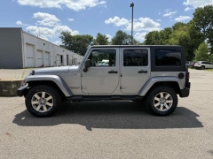 Used 2013 Jeep Wrangler Unlimited 4d Convertible Sahara at Paradise Motors near Lansing, MI