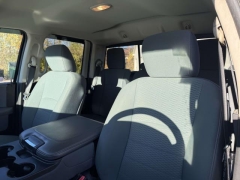 Used 2014  Ram 1500 4WD Quad Cab SLT at Paradise Motors near Lansing, MI