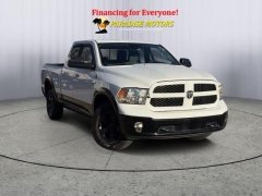 Used 2014  Ram 1500 4WD Quad Cab SLT at Paradise Motors near Lansing, MI