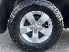 Used 2014  Ram 1500 4WD Quad Cab SLT at City Wide Auto Credit near Toledo, OH