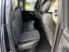 Used 2016  Ram 1500 4WD Quad Cab Laramie at House of Carz near Rochester&comma; IN