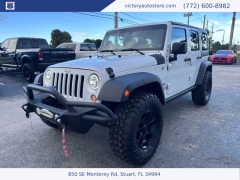 Used 2014 Jeep Wrangler Unlimited 4WD 4dr Sport at Victory Auto Store near Stuart, FL