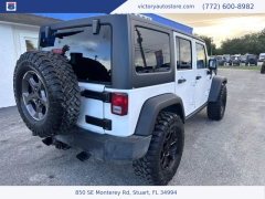 Used 2014 Jeep Wrangler Unlimited 4WD 4dr Sport at Victory Auto Store near Stuart, FL