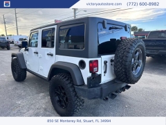 Used 2014 Jeep Wrangler Unlimited 4WD 4dr Sport at Victory Auto Store near Stuart, FL