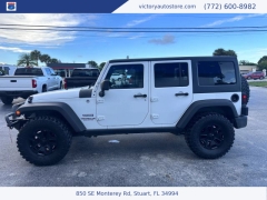 Used 2014 Jeep Wrangler Unlimited 4WD 4dr Sport at Victory Auto Store near Stuart, FL