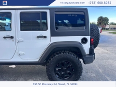 Used 2014 Jeep Wrangler Unlimited 4WD 4dr Sport at Victory Auto Store near Stuart, FL