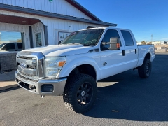 Used 2014  Ford Super Duty F-350 SRW 4WD Crew Cab 156" Lariat at J & J Autoplex near Garden City, KS