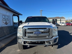 Used 2014  Ford Super Duty F-350 SRW 4WD Crew Cab 156" Lariat at J & J Autoplex near Garden City, KS