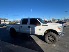 Used 2014  Ford Super Duty F-350 SRW 4WD Crew Cab 156" Lariat at J & J Autoplex near Garden City, KS