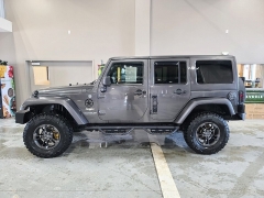 Used 2014  Jeep Wrangler Unlimited 4WD 4dr Sahara at J's Auto near Manchester&comma; IA