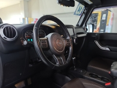 Used 2014  Jeep Wrangler Unlimited 4WD 4dr Sahara at J's Auto near Manchester, IA