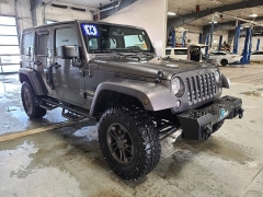 Used 2014  Jeep Wrangler Unlimited 4WD 4dr Sahara at J's Auto near Manchester&comma; IA