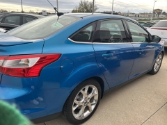 Used 2014  Ford Focus 4d Sedan Titanium at Carrikers Auto Outlet near Oskaloosa&comma; IA