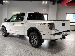 Used 2015  Nissan Titan 4WD Crew Cab PRO-4X at Carrikers Auto Outlet near Oskaloosa&comma; IA