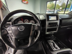 Used 2015  Nissan Titan 4WD Crew Cab PRO-4X at Carrikers Auto Outlet near Oskaloosa&comma; IA
