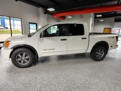 Used 2015  Nissan Titan 4WD Crew Cab PRO-4X at Carrikers Auto Outlet near Oskaloosa&comma; IA