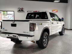 Used 2015  Nissan Titan 4WD Crew Cab PRO-4X at Carrikers Auto Outlet near Oskaloosa&comma; IA