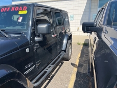 Used 2009 Jeep Wrangler Unlimited 4d Convertible 4WD Sahara at Suburban Ford of Sterling Heights near Sterling Heights, MI