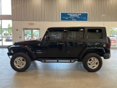 Used 2009 Jeep Wrangler Unlimited 4d Convertible 4WD Sahara at Suburban Ford of Sterling Heights near Sterling Heights, MI