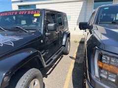 Used 2009 Jeep Wrangler Unlimited 4d Convertible 4WD Sahara at Suburban Ford of Sterling Heights near Sterling Heights, MI