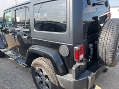 Used 2016 Jeep Wrangler Unlimited 4WD 4dr Sahara at Suburban Ford of Sterling Heights near Sterling Heights, MI