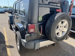 Used 2009 Jeep Wrangler Unlimited 4d Convertible 4WD Sahara at Suburban Ford of Sterling Heights near Sterling Heights, MI