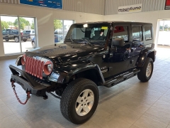 Used 2009 Jeep Wrangler Unlimited 4d Convertible 4WD Sahara at Suburban Ford of Sterling Heights near Sterling Heights, MI
