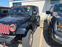 Used 2009 Jeep Wrangler Unlimited 4d Convertible 4WD Sahara at Suburban Ford of Sterling Heights near Sterling Heights, MI
