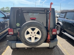 Used 2009 Jeep Wrangler Unlimited 4d Convertible 4WD Sahara at Suburban Ford of Sterling Heights near Sterling Heights, MI