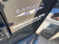 Used 2009 Jeep Wrangler Unlimited 4d Convertible 4WD Sahara at Suburban Ford of Sterling Heights near Sterling Heights, MI