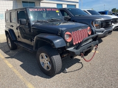 Used 2009 Jeep Wrangler Unlimited 4d Convertible 4WD Sahara at Suburban Ford of Sterling Heights near Sterling Heights, MI