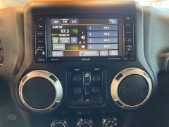 Used 2016  Jeep Wrangler Unlimited 4WD 4dr Sahara at Maxx Loans near St. Adrian, MI