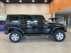 Used 2009 Jeep Wrangler Unlimited 4d Convertible 4WD Sahara at Suburban Ford of Sterling Heights near Sterling Heights, MI