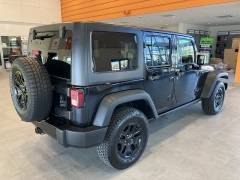 Used 2017  Jeep Wrangler Unlimited Willys Wheeler 4x4 at Maxx Loans near St. Adrian, MI