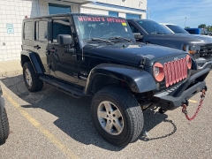 Used 2009 Jeep Wrangler Unlimited 4d Convertible 4WD Sahara at Suburban Ford of Sterling Heights near Sterling Heights, MI
