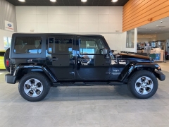 Used 2016  Jeep Wrangler Unlimited 4WD 4dr Sahara at Maxx Loans near St. Adrian, MI