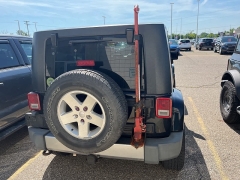 Used 2009 Jeep Wrangler Unlimited 4d Convertible 4WD Sahara at Suburban Ford of Sterling Heights near Sterling Heights, MI