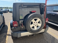 Used 2009 Jeep Wrangler Unlimited 4d Convertible 4WD Sahara at Suburban Ford of Sterling Heights near Sterling Heights, MI